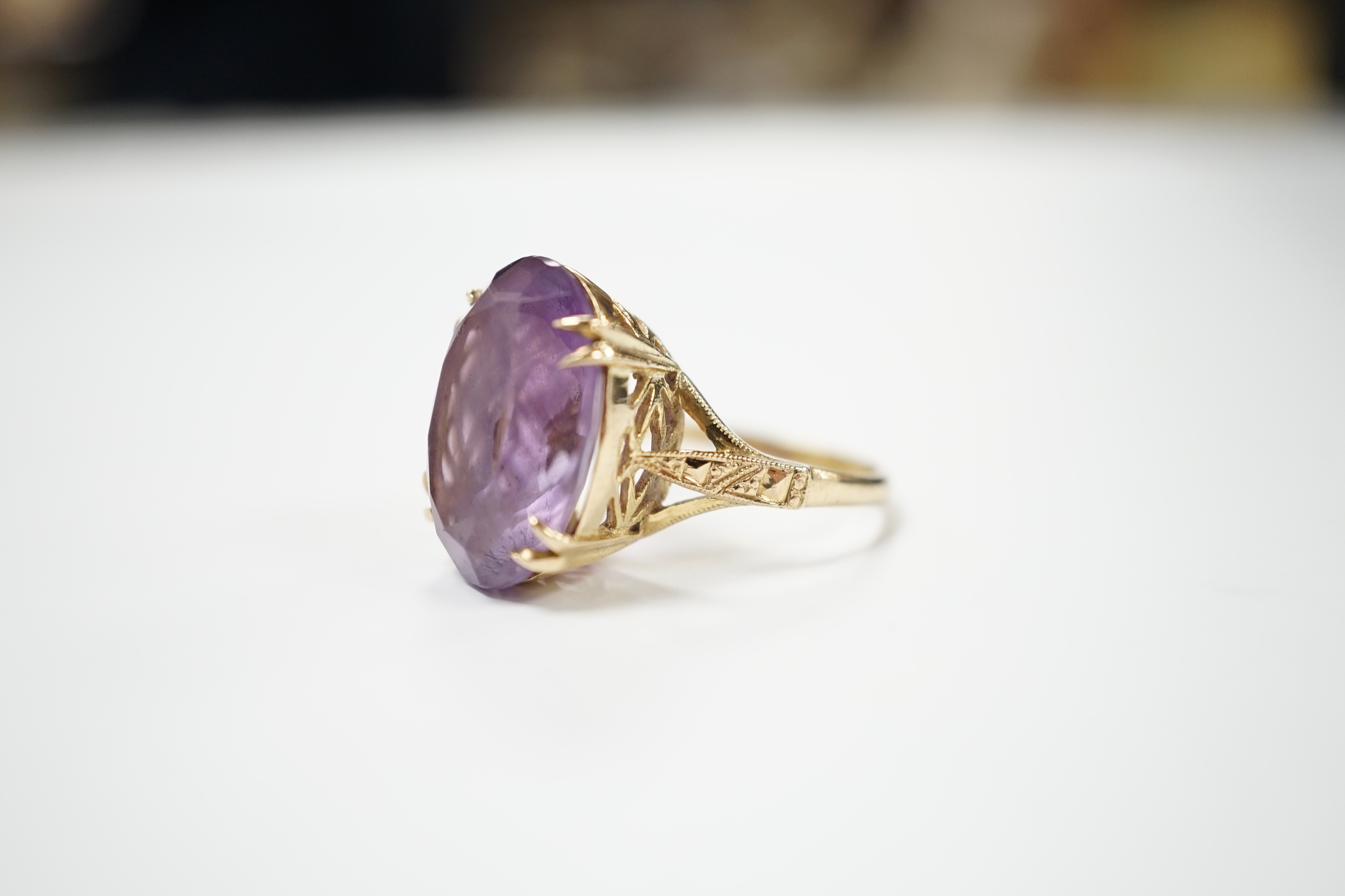 A modern 9ct gold and oval cut amethyst set dress ring, size M, gross weight 5.9 grams.